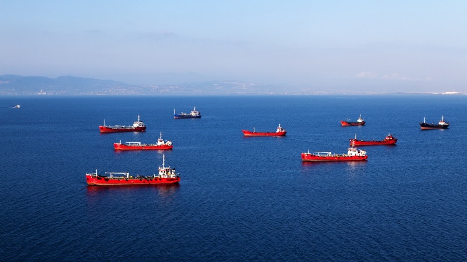 Nine container vessels waiting to be loaded