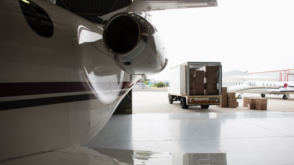 Packages ready to load on charter plane