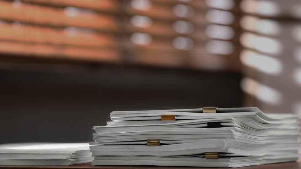 organized documents sitting on a desk