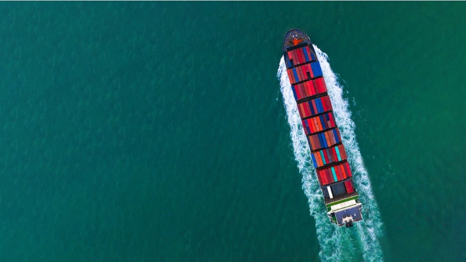 ocean container ship sailing through the ocean